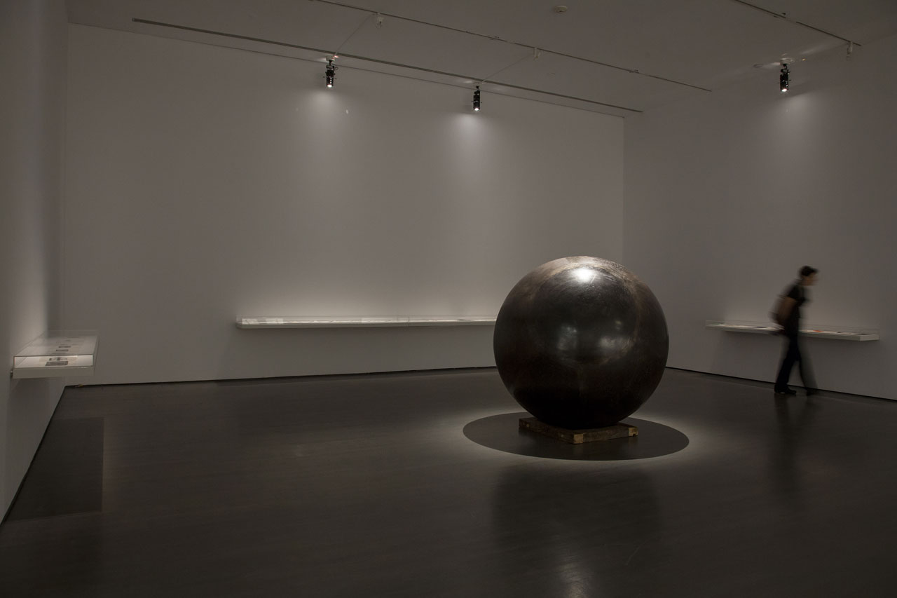 Hajra Waheed, Installation view of 'KH-21', 2014, La Biennale de Montreal (BNLMTL) at the Musee d'art contemporain de Montréal, Sound Sculpture Steel, Brass, Leather &amp; Wood 64 in. sphere diameter / 25ft. cord / 10 min. loop. Image courtesy the artist.