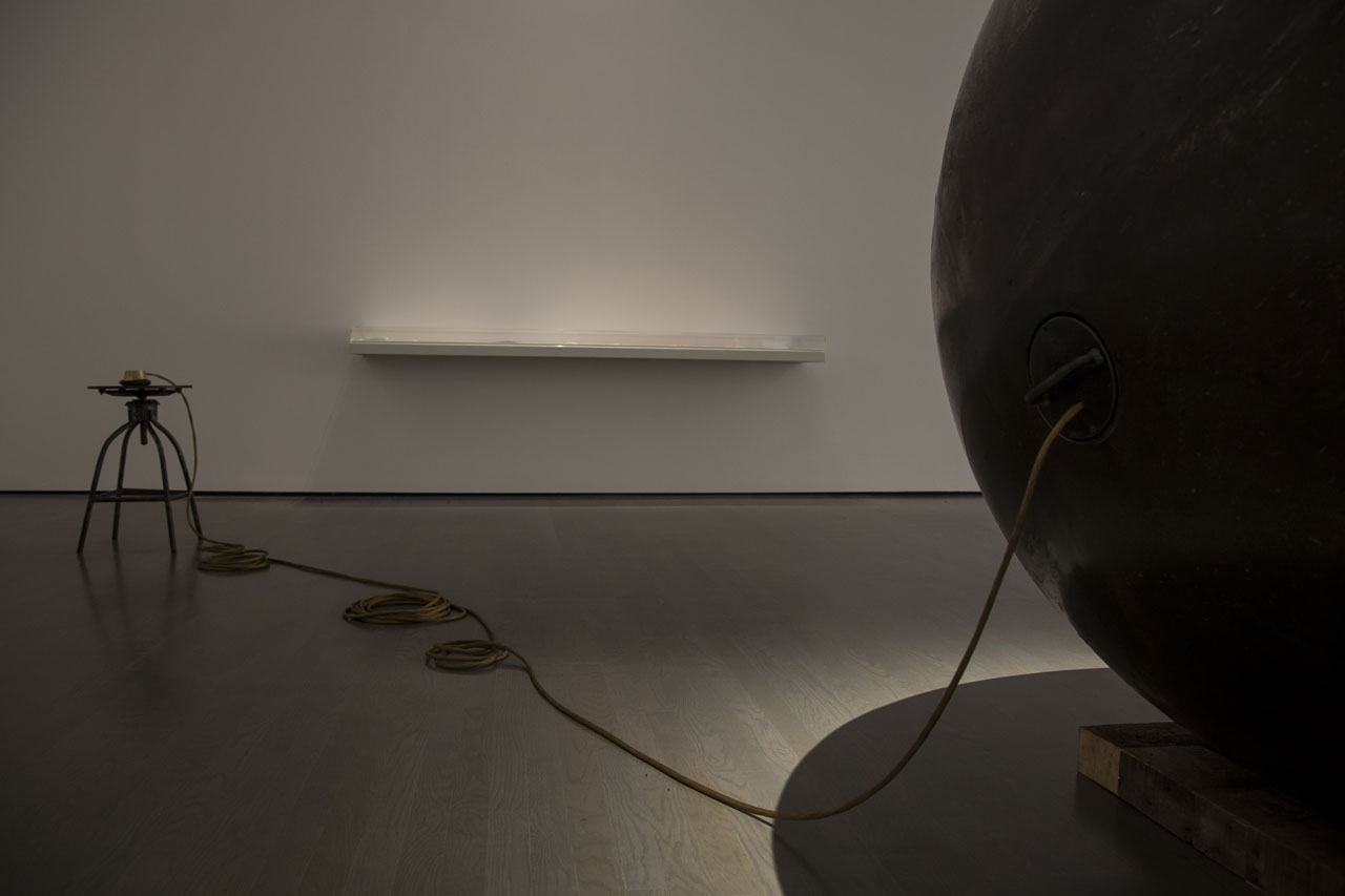 Hajra Waheed, Installation view of 'KH-21', 2014, La Biennale de Montreal (BNLMTL) at the Musee d'art contemporain de Montréal, Sound Sculpture Steel, Brass, Leather &amp; Wood 64 in. sphere diameter / 25ft. cord / 10 min. loop. Image courtesy the artist.