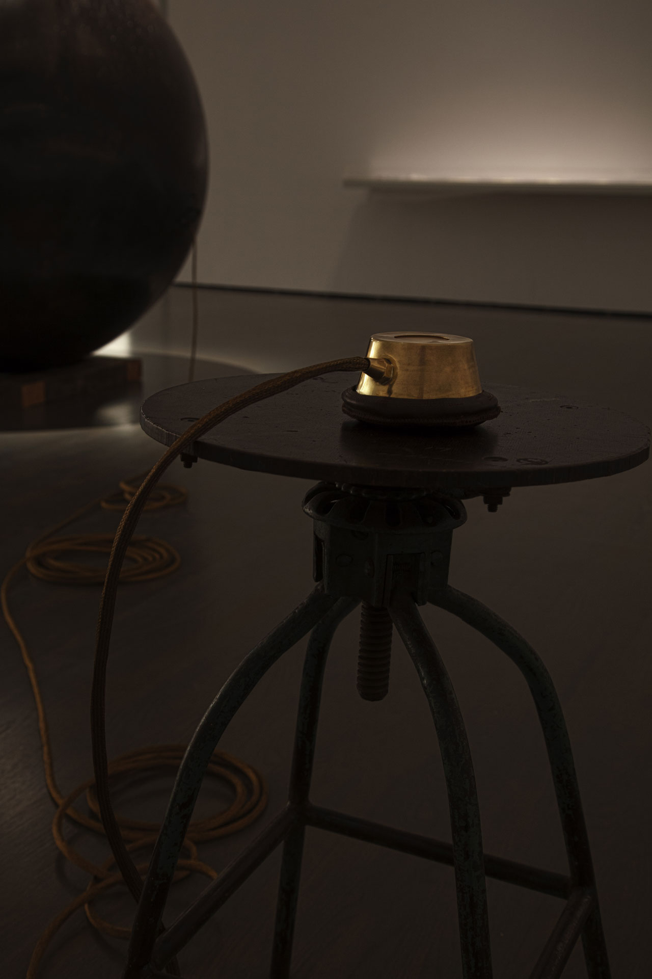 Hajra Waheed, Installation detail of 'KH-21', 2014, La Biennale de Montréal (BNLMTL) at the Musée d'art contemporain de Montréal, Sound Sculpture Steel, Brass, Leather & Wood 64 in. sphere diameter / 25ft. cord / 10 min. loop. Image courtesy the artist.